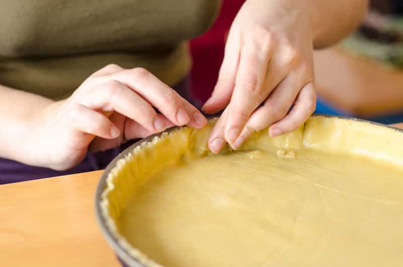 Baker shaping pie crust
