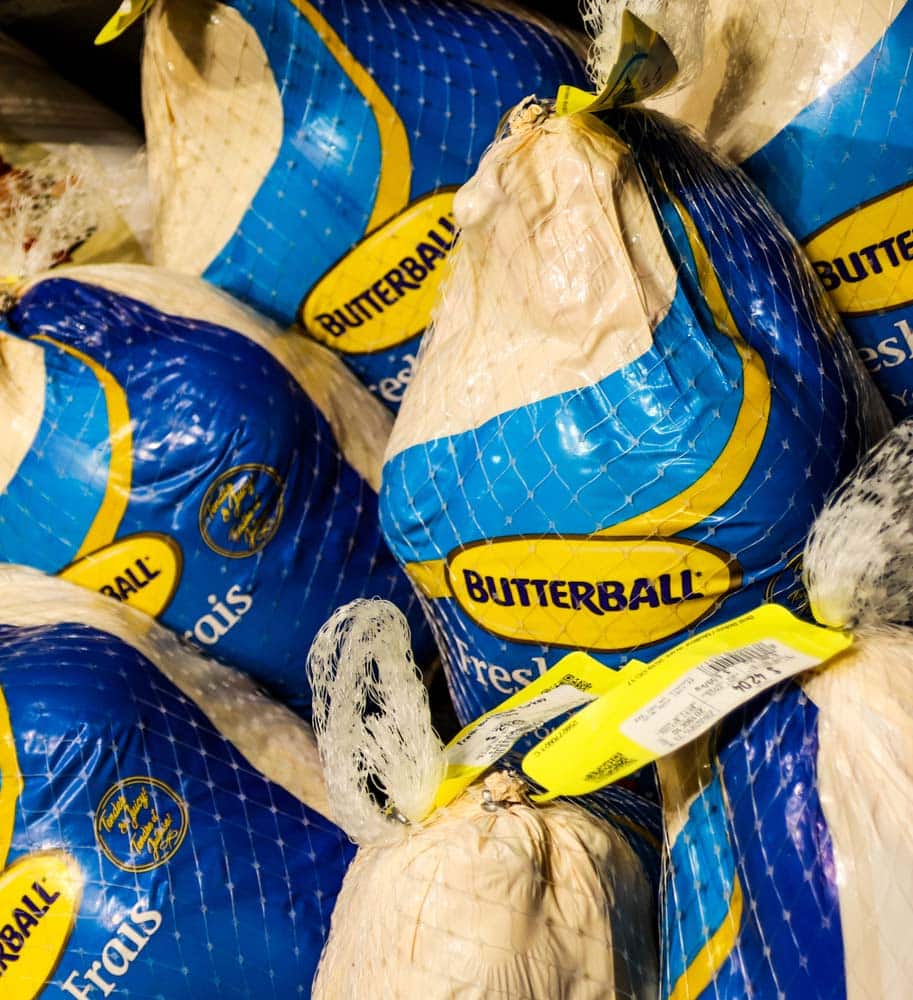 A group of fresh Butterball turkeys in blue and yellow packaging for sale in supermarket