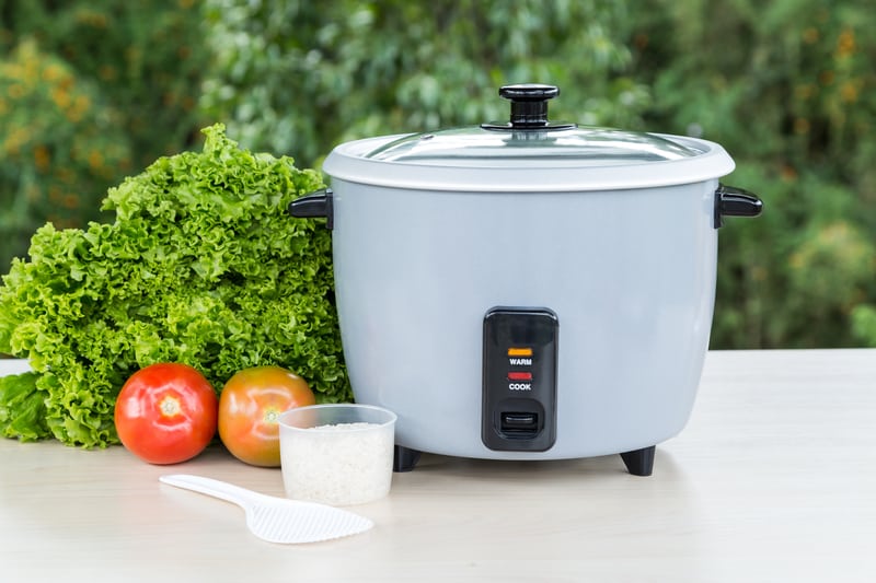 Rice cooker with vegetables on the side