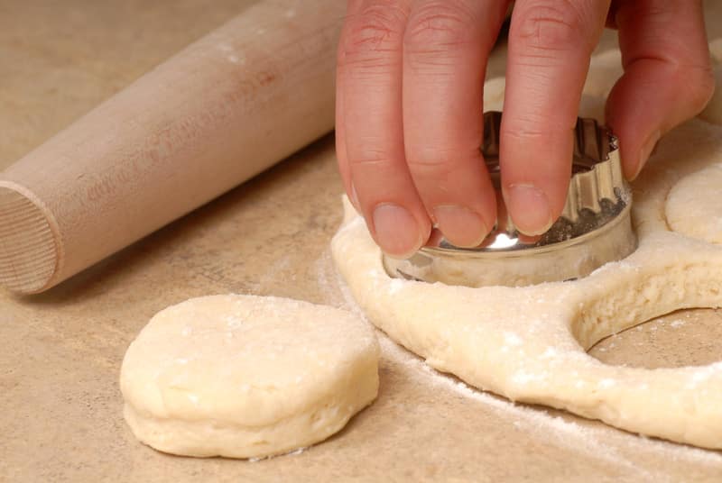 Cutting out buttermilk biscuit dough