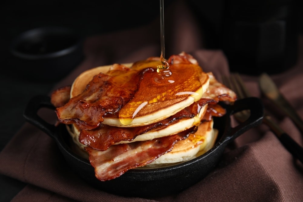 pancakes with maple syrup and fried bacon