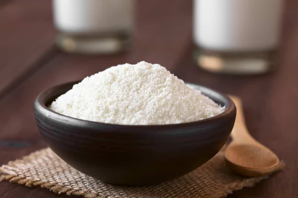 Powdered or dried milk in small bowl