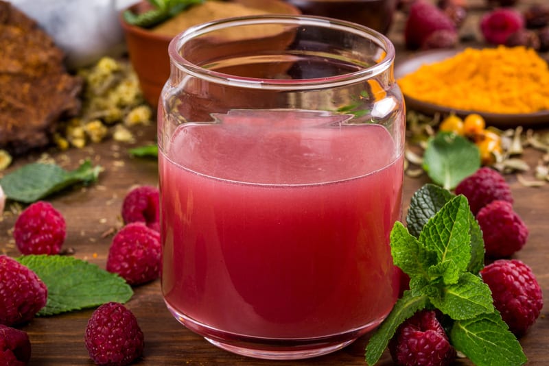 Raspberry extract is stirred in water