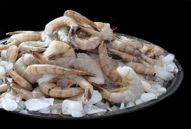 Fresh raw shrimp piled high on crushed ice