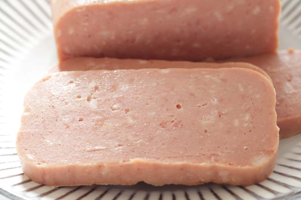 Canned food, luncheon meat sliced on dish