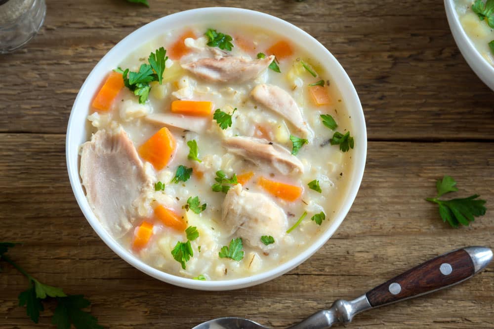 Homemade fresh creamy soup with chicken and vegetables