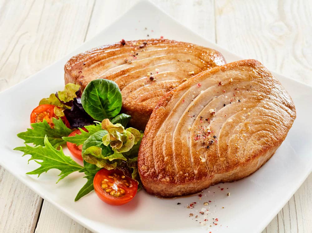 Close Up Still Life of Two Fried Tuna Steaks 