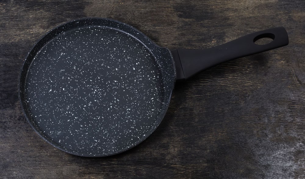 Empty modern flat shallow frying pan for cooking pancakes