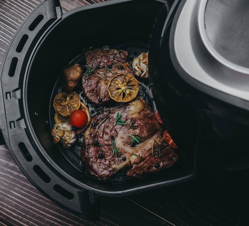 Air fryer with food inside