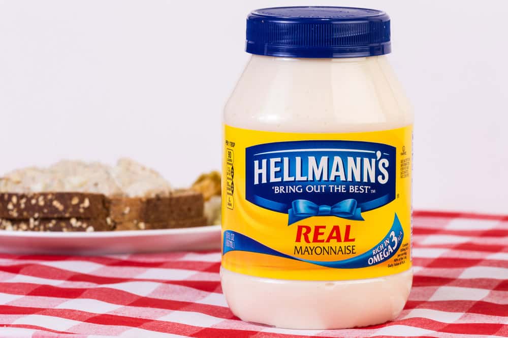 Hellmann's Mayonnaise on table with bread