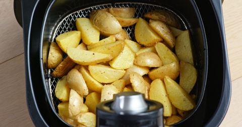 Potato in air fryer basket