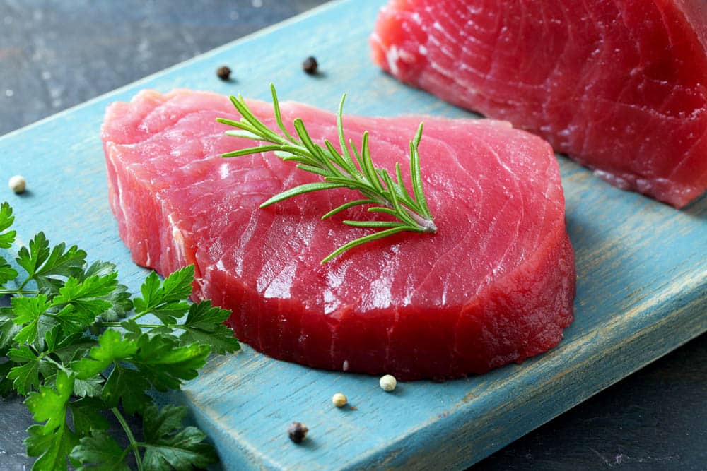 raw red tuna fish on gray background