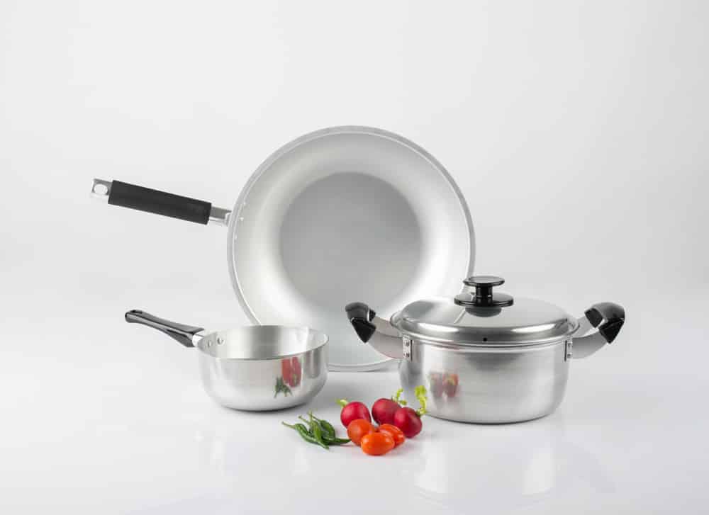 Stainless steel pots and pan with vegetables