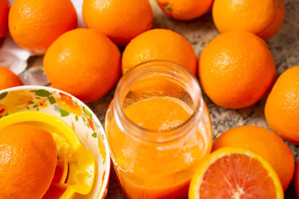 A view looking down at several cara cara oranges