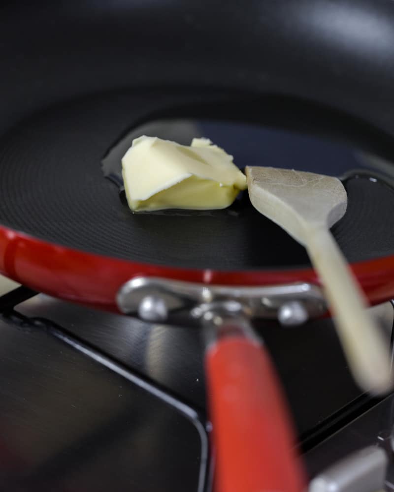 Focus on melting butter on hot hard anodized skillet with wooden spatula