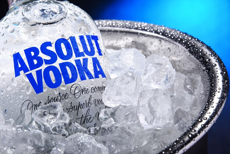Bottle of Absolut Vodka in bucket with crushed ice