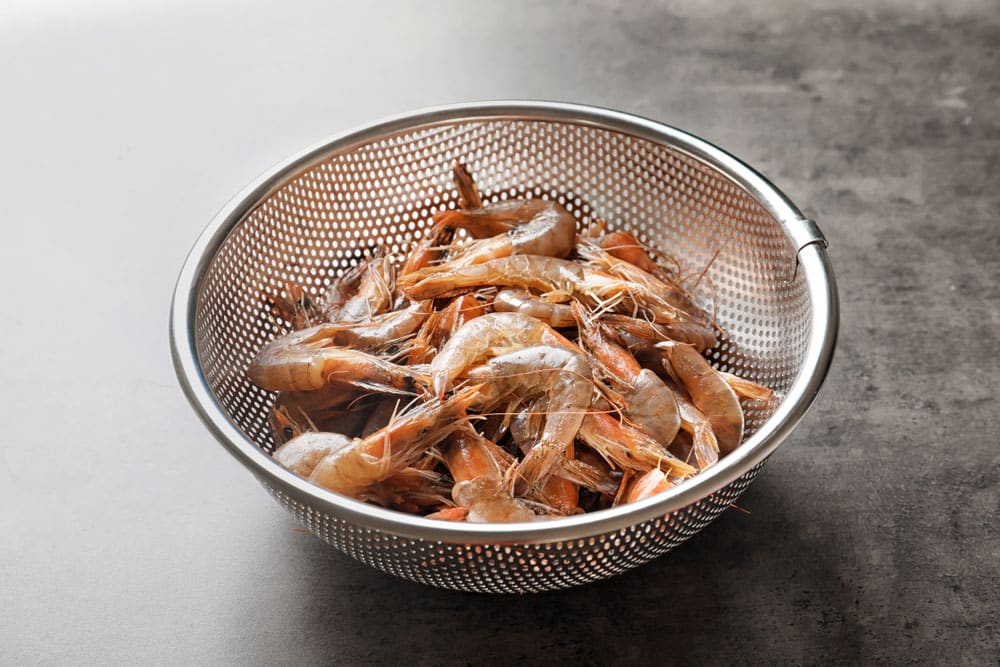 Colander with fresh shrimps