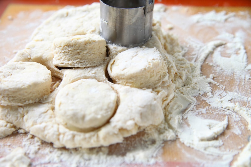 Preparing biscuits on floured surface