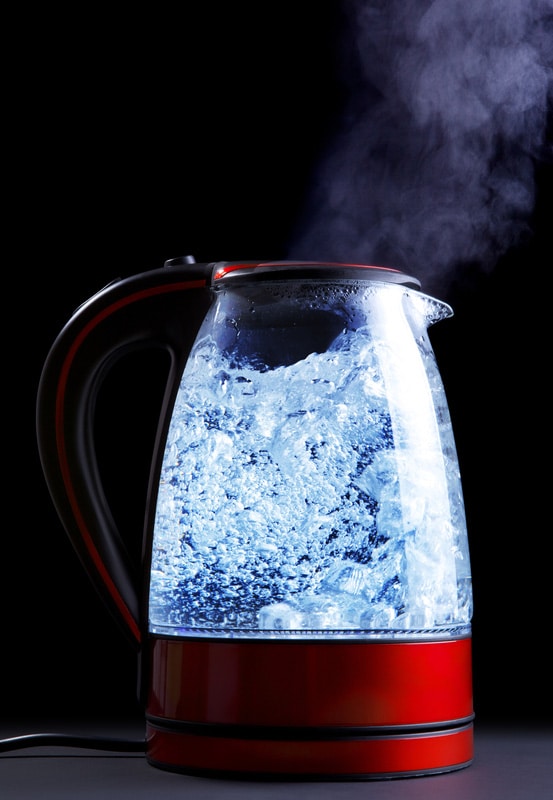 Glass electric kettle with boiling water