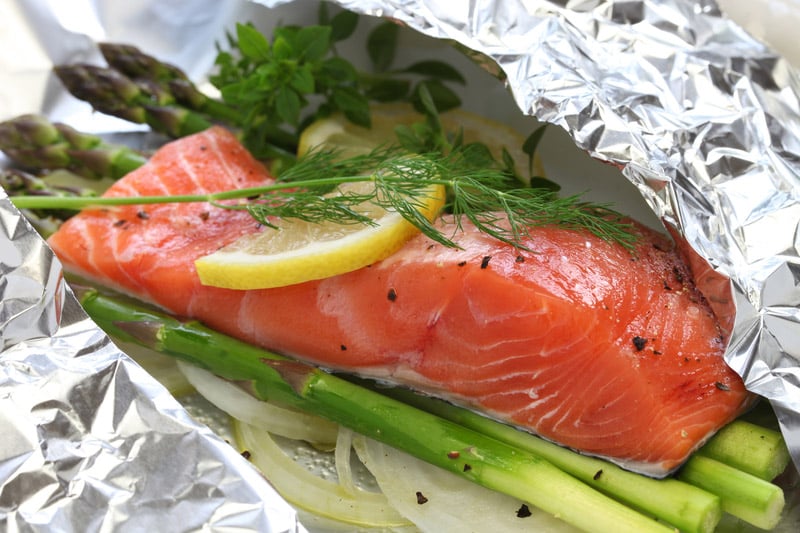 Fresh salmon with asparagus in foil