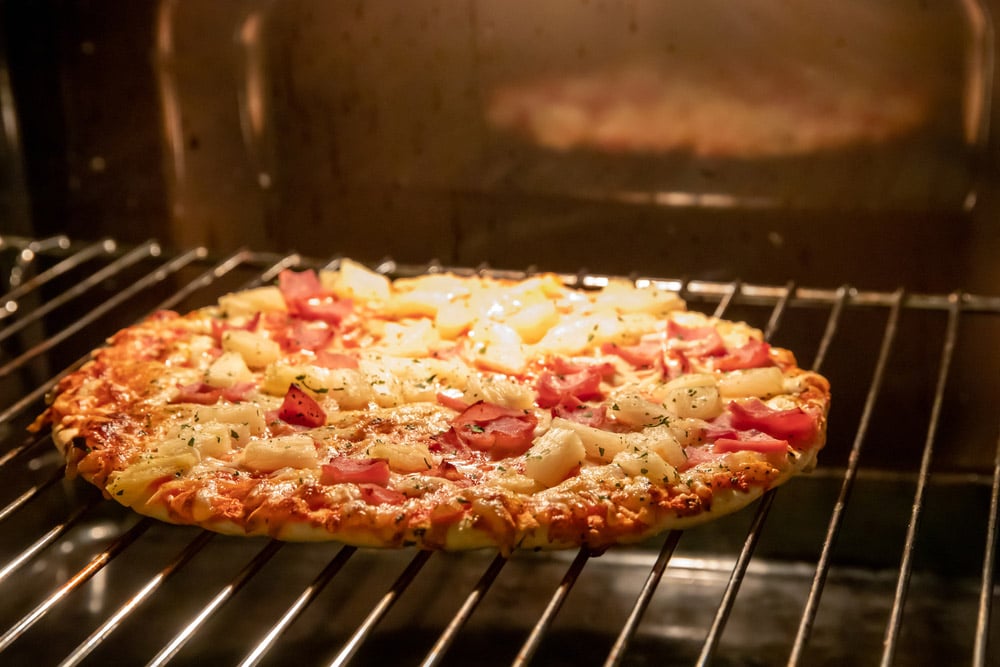 Frozen pizza in electric oven