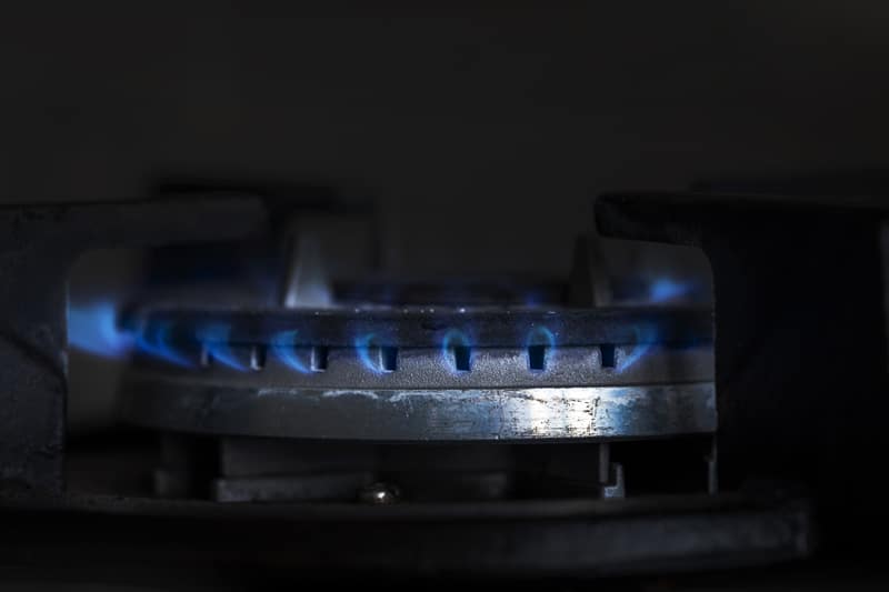 Gas stove with included gases on a dark background