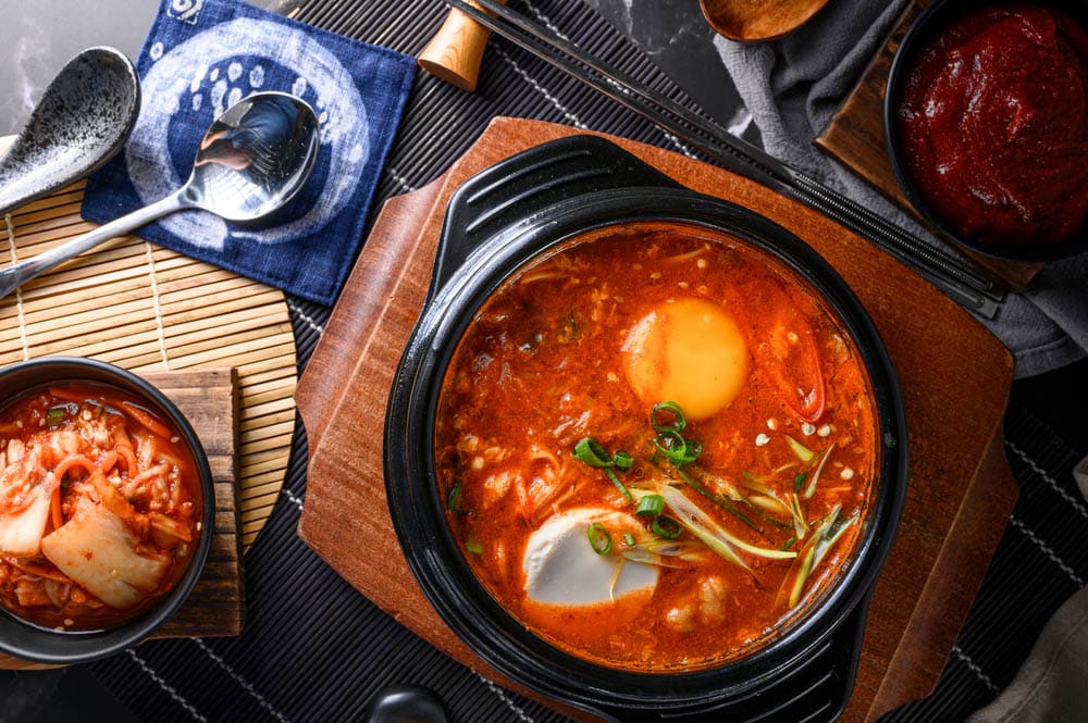 Korean hot tofu stew with rice and side dish