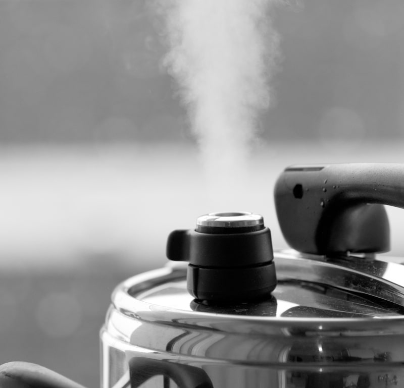 Steam escaping from pressure cooker
