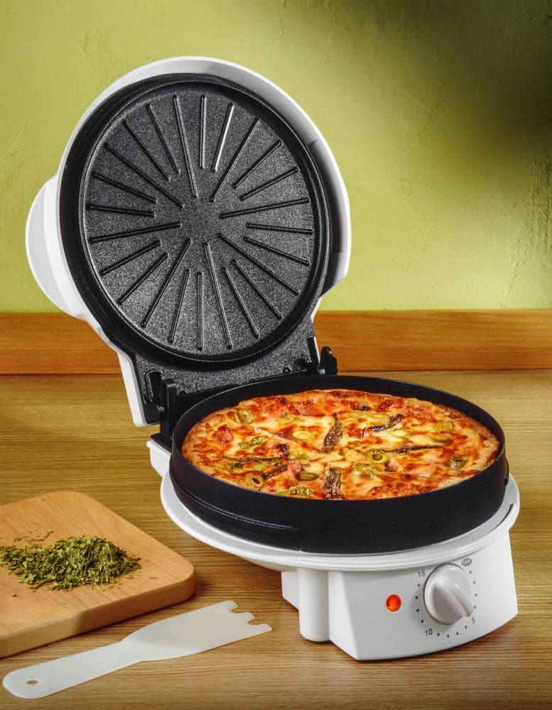 Electric pizza oven on kitchen table