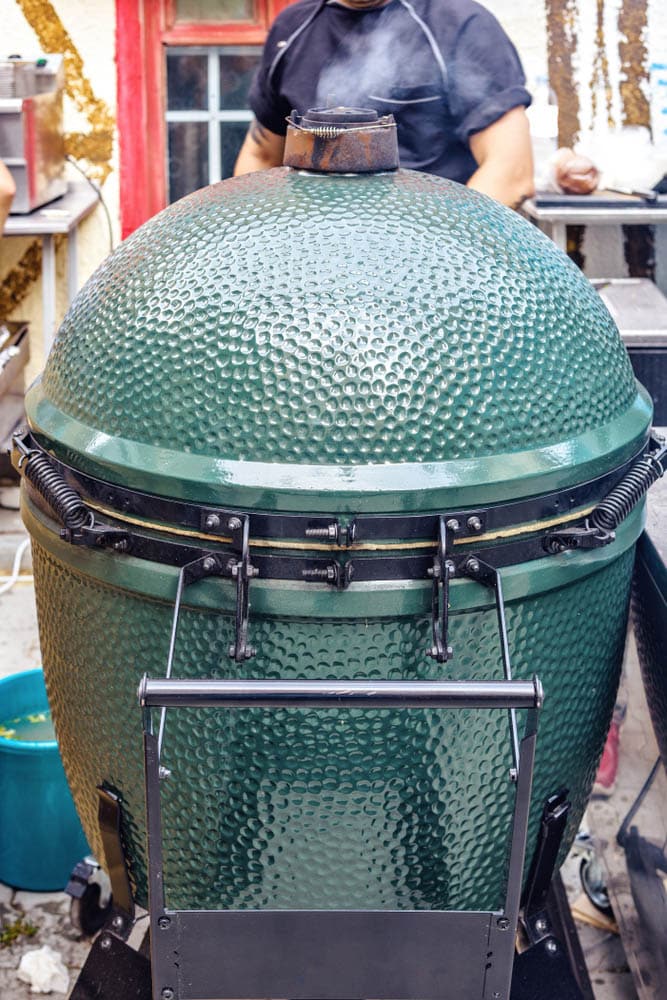 Kamado-style green color ceramic charcoal barbecue cooker