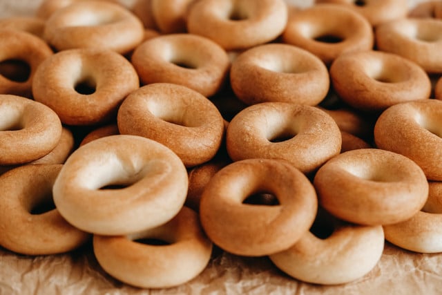 Drying or mini round bagels on a white wooden background