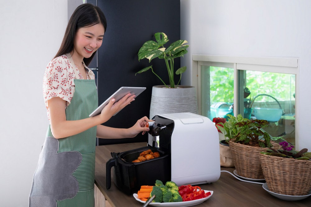 Asian wife made Ollies Air Fryer machine for cooking a fried chicken