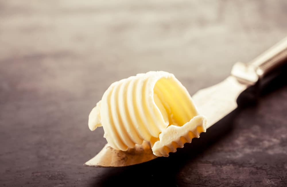 Close up Butter on a Knife for Bread Filling