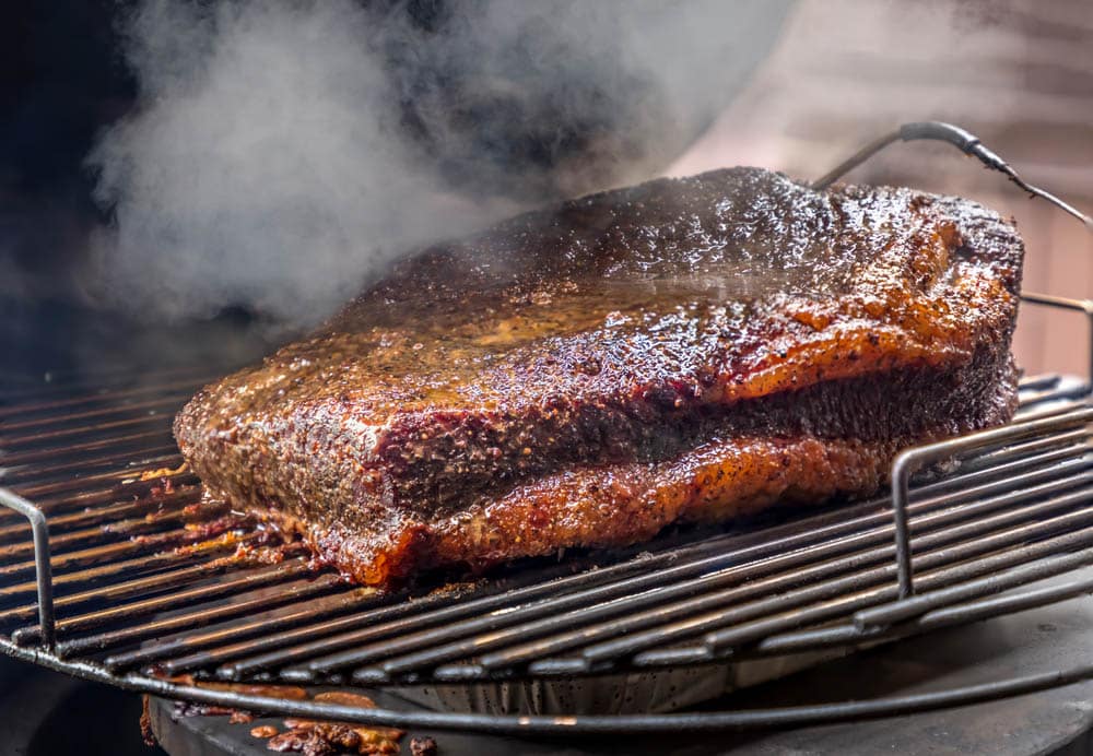 Fresh smoked Texas bbq brisket on the grill