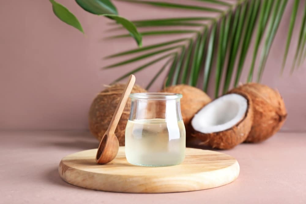 Jar of coconut oil and spoon