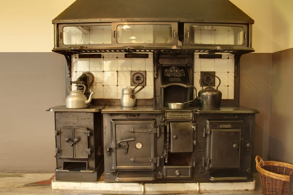 Old cooker with kettles and pans