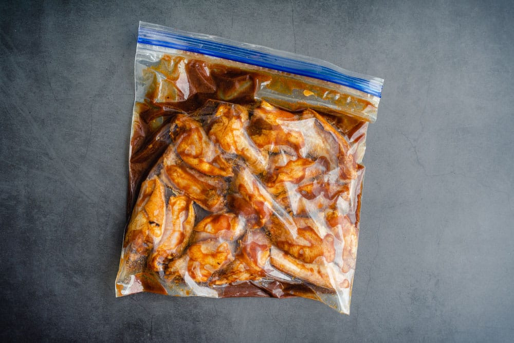 Raw Chicken Wings Marinating in a Plastic Bag