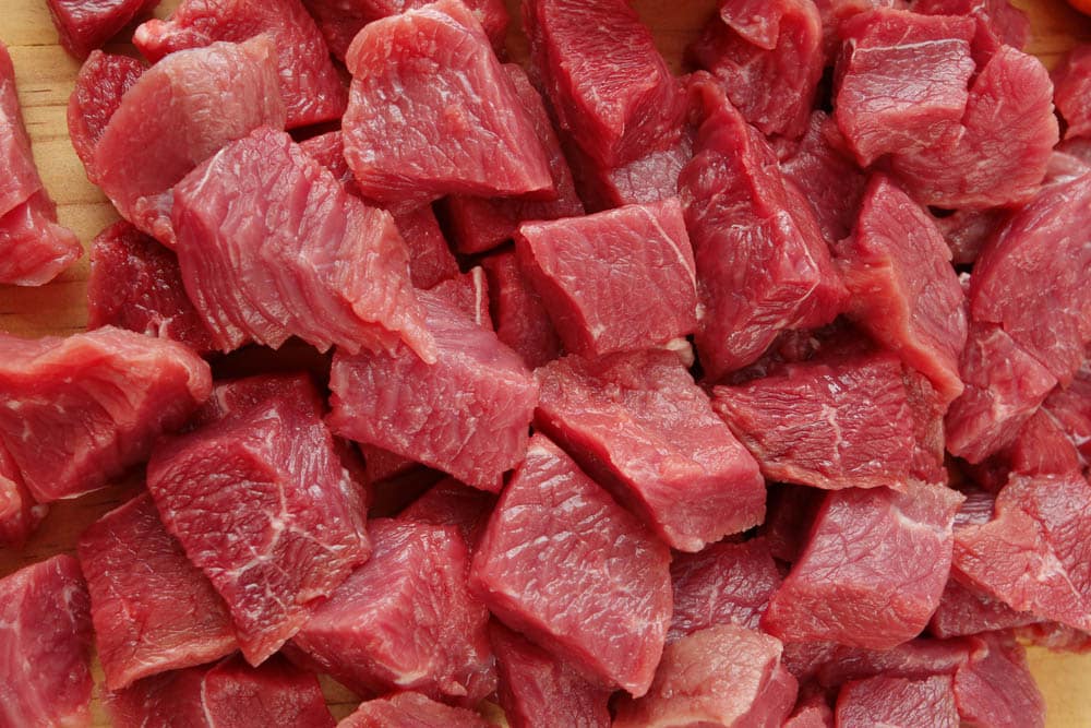 Raw cutting beef on wooden plate