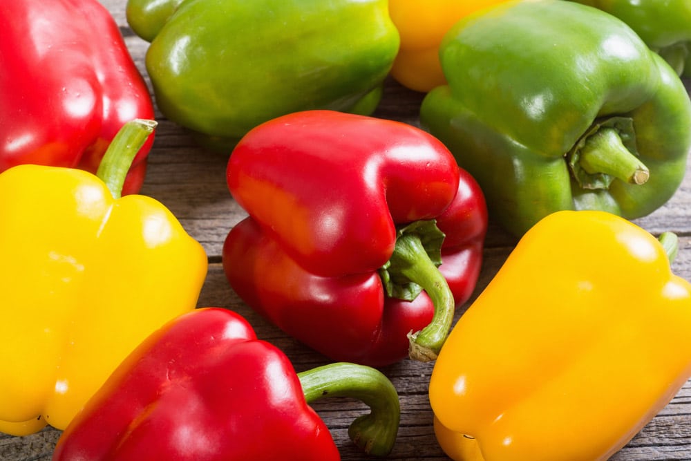 Colorful green, red and yellow peppers paprika