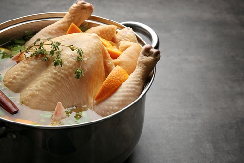 Cooking pot with turkey soaked in flavored brine