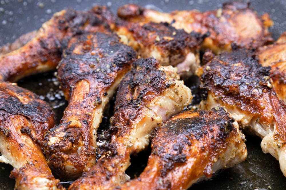 Fried chicken in a pan, chicken legs