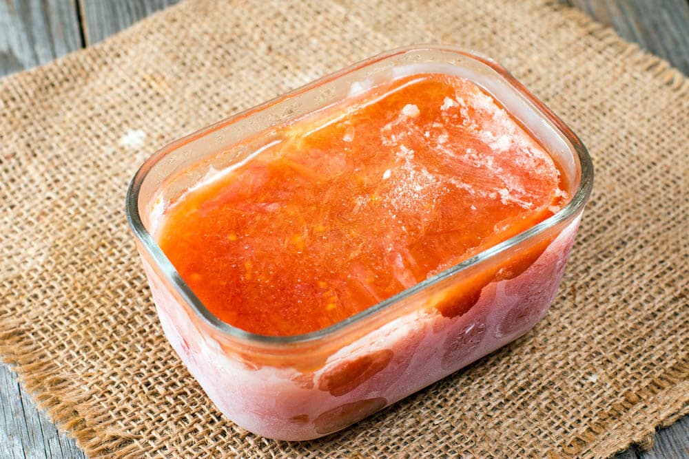 Frozen salsa sauce in a glass container