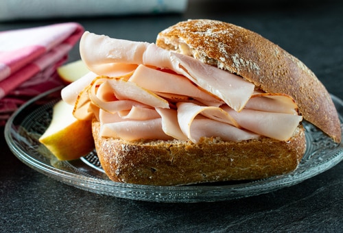 Rye bun with ham on a Plate