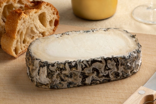 Slice of  Spanish Monte Enebro artisan cheese