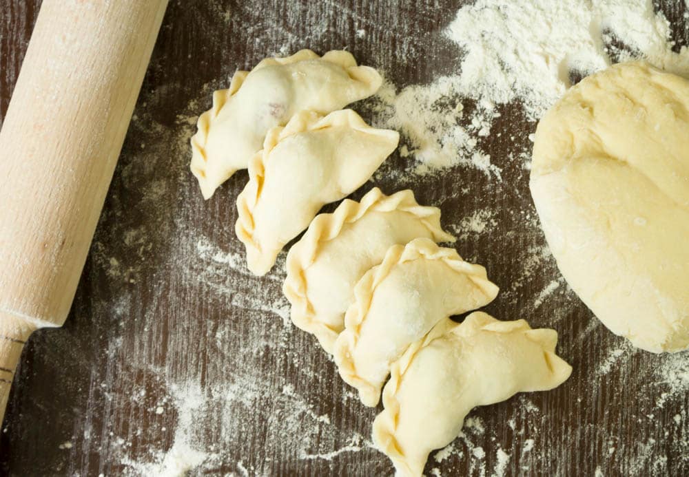 Top view of five dumplings with cherries