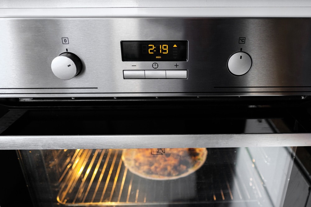 A working oven with a timer heats food