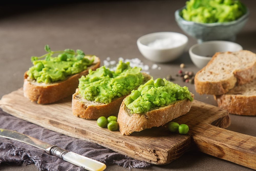 Baguette with mashed green peas