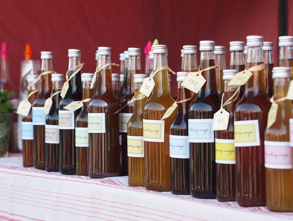 glass bottles with premium herb and fruit syrups