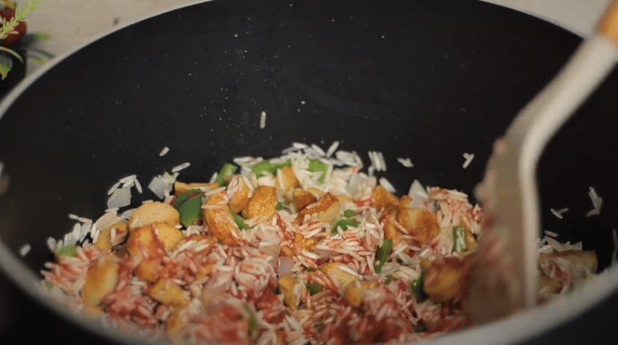 cooking rice with tomato sauce