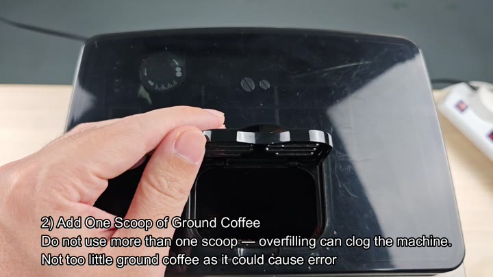 Add one scoop of ground coffee Add one scoop of ground coffee